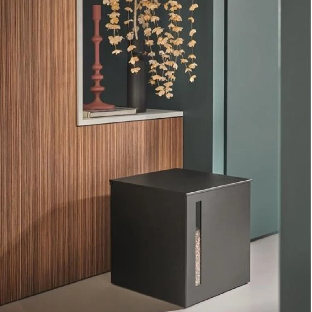 Designsanstitre_36 - ECOPELETY Black rectangular trash bin with a vertical window showing contents, against a wood-paneled wall in a modern interior.