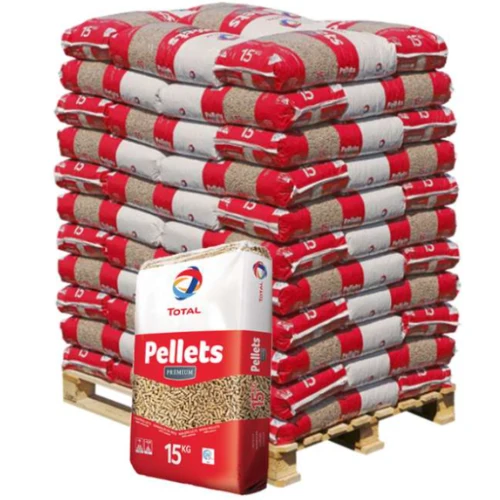 Pallet loaded with stacked red-and-brown bags of wood pellets and a front bag labeled Pellets Premium 15 kg (Total brand).